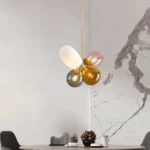 Artistic Dining Room with Mid-Century Modern Colorful Glass Pendant