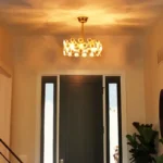 Warm glowing night view of ceramic flower ceiling fan in dark room