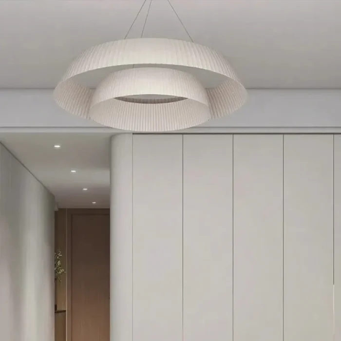 warm-lighting-pleated-fabric-pendant-above-bed